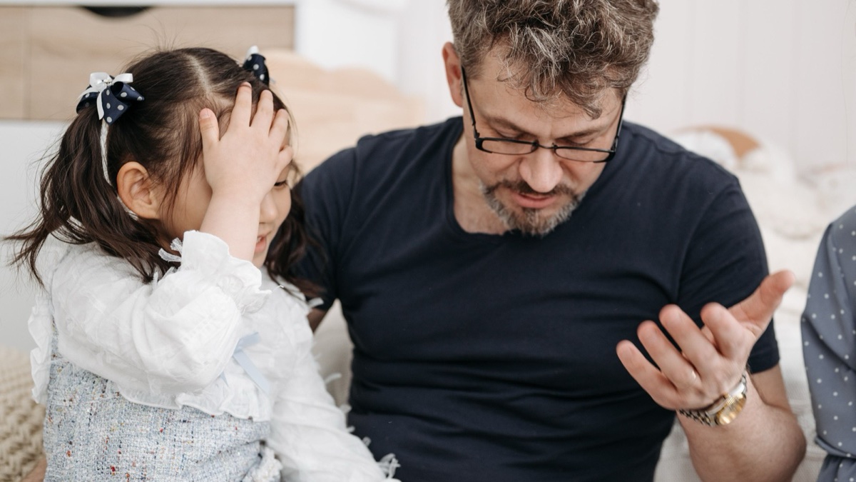 A parent talking with their child